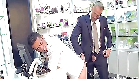 Tattooed couple has fun while in a convenience store