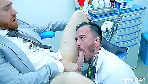 Red-haired medical girl giving massage and handjob