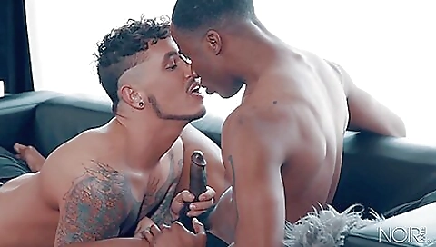 Black guy peeping on his tattooed ass with a white guy