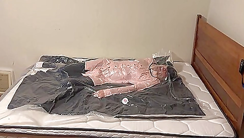 Teenage brunette gets a big latex face shield to bang a big dildo