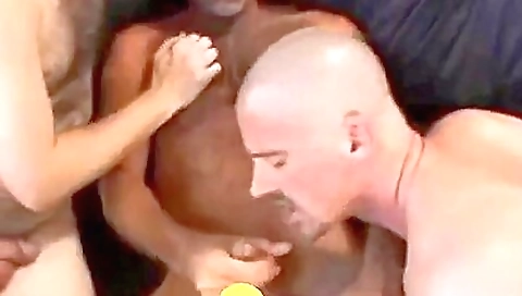 A big black dude gets fucked by two other big white dicks