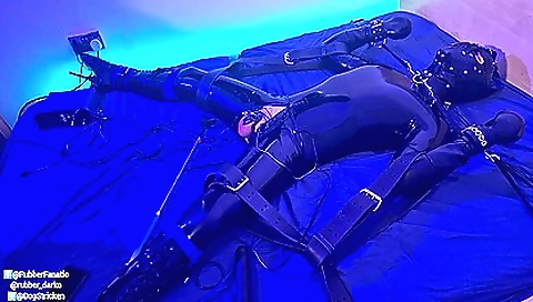 Latex bondage session with a guy with a gimp on his ass