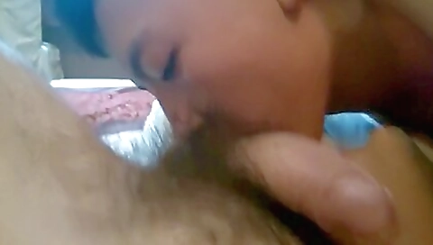 Asian teen in white blouse sucks an older dude's dick