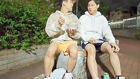 Japanese couple with tattooed brunette have outdoor movie