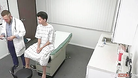Skinny twink gives a blowjob to his teen in a medical room