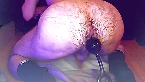 Girl with a large anal hole is getting anal fisting